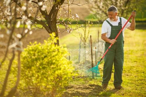 Two gardeners working on a communal courtyard near Westfield Stratford